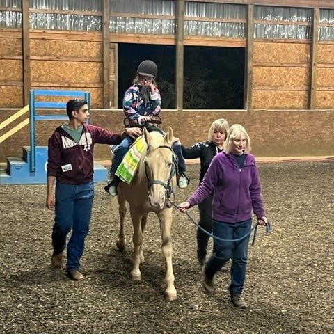 Haley Riding a Horse